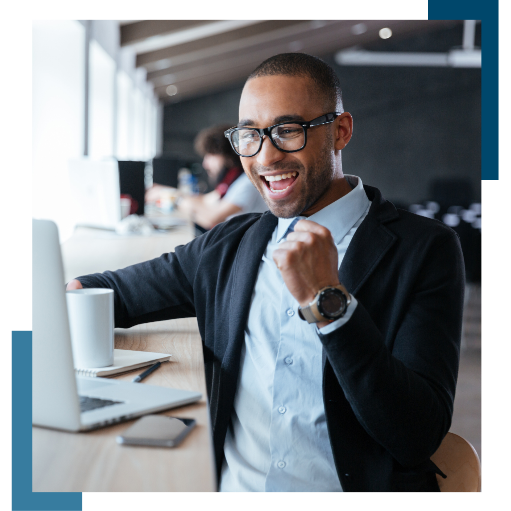 Man at computer looking happy