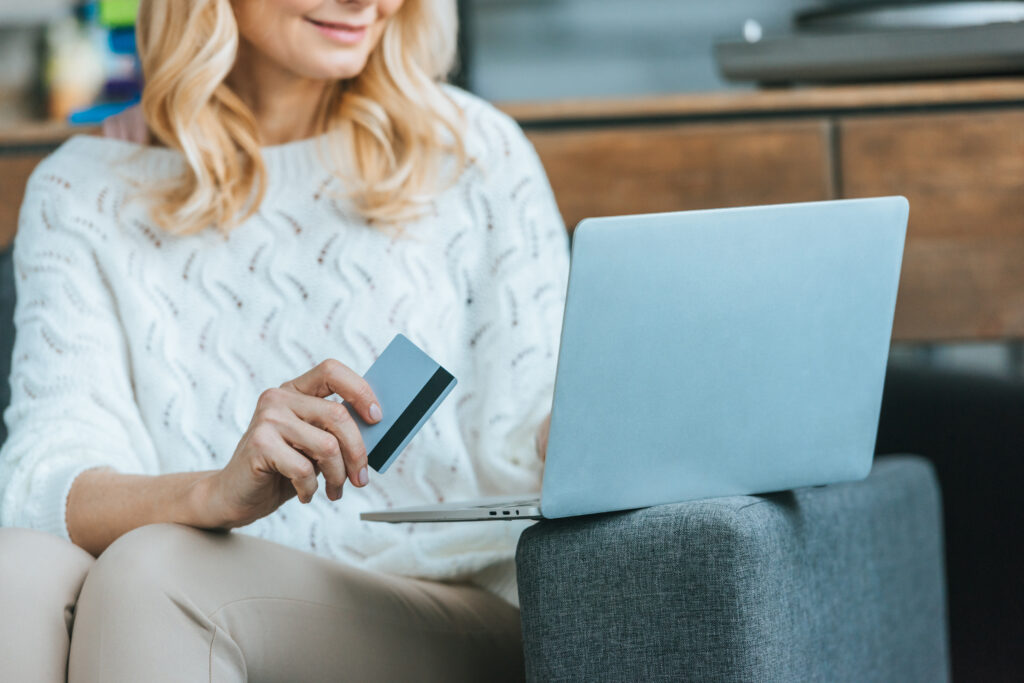 A woman donating to a nonprofit on her laptop