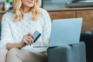 A woman donating to a nonprofit on her laptop